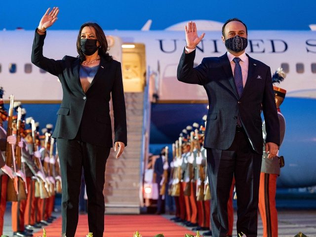 US Vice President Kamala Harris waves alongside Guatemala's Minister of Foreign Affai