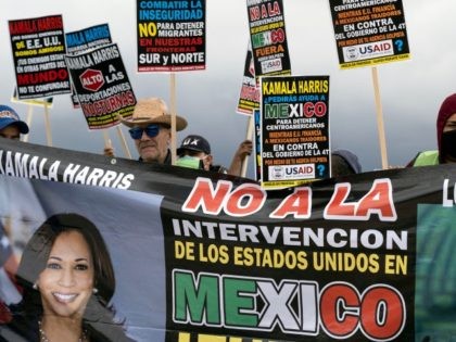 Migrants and pro-migrants advocates demonstrate at the US Consulate in Tijuana, Baja California state, Mexico on June 7, 2021. - Demonstrators asked US government to stop its 'intervention' in Mexico and a better treatment for migrants ahead of US Vice President Kamala Harris visit to Mexico City tomorrow. (Photo by …