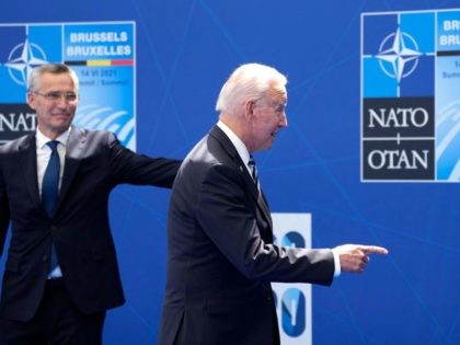 President Joe Biden (R) is greeted by NATO Secretary General Jens Stoltenberg at the NATO summit at NATO headquarters in Brussels, on June 14, 2021. - The 30-nation alliance hopes to reaffirm its unity and discuss increasingly tense relations with China and Russia, as the organization pulls its troops out …