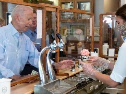 US President Joe Biden orders an ice cream cone while visiting the The Pearl Ice Cream Parlor & Confectionery in La Crosse, Wisconsin, June 29, 2021. - US President Joe Biden stood in an oily, machinery filled warehouse in Wisconsin to tout his multi-trillion dollar infrastructure plans Tuesday, arguing that …