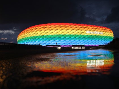 MUNICH, GERMANY - JULY 11: A general view outside of the soccer stadium Allianz Arena which is illuminated in rainbow colours for Christopher Street Day (CSD) on July 11, 2020 in Munich, Germany. Christopher Street Day is an annual European LGBT celebration and demonstration held in various cities across Europe …