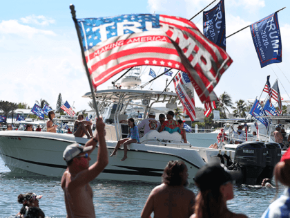 An American Trump flag waves as boaters show their support for President Donald Trump at the start to a parade down the Intracoastal Waterway to just off the shore of President Trump's home at Mar-a-Lago on September 07, 2020 in West Palm Beach, Florida. Reports indicated that the president’s son, …