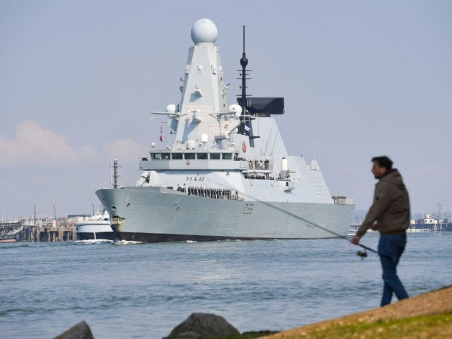 PORTSMOUTH, ENGLAND - MAY 01: HMS Defender leaves Portsmouth on May 01, 2021 in Portsmouth, United Kingdom. The UK’s Carrier Strike Group, led by aircraft carrier HMS Queen Elizabeth, will visit more than one fifth of the world’s nations during the deployment. The task group will visit 40 nations covering …