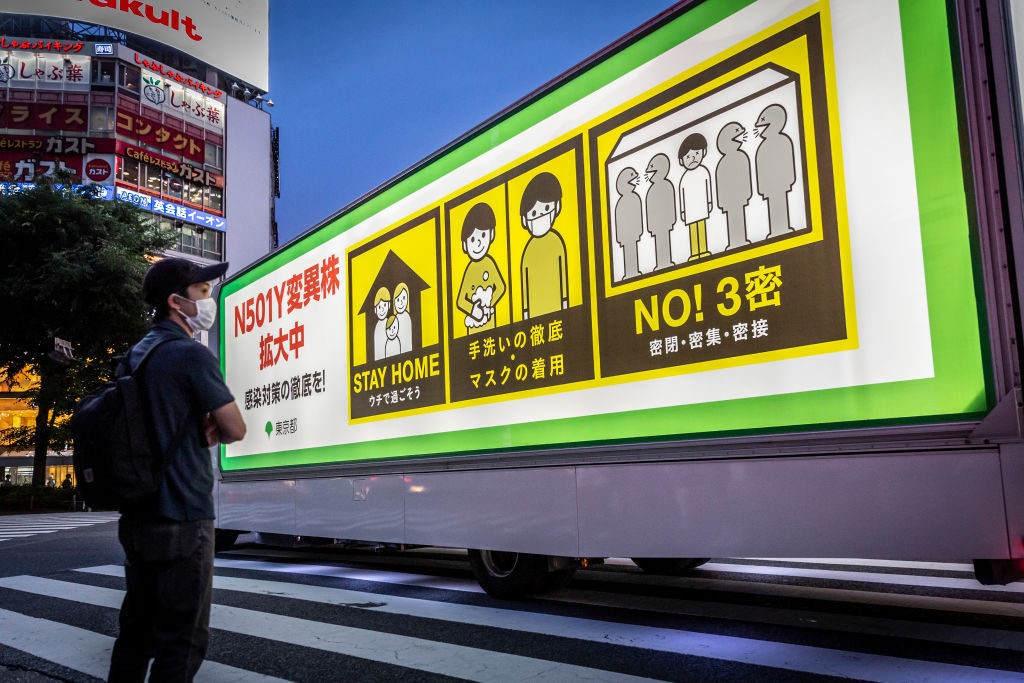 An ad truck warning of the danger of the coronavirus is driven through Shibuya crossing on May 28, 2021 in Tokyo, Japan. The government extended the current state of emergency as Japan continues to grapple with a fourth wave of coronavirus that has seen hospital beds in Osaka reach 96 percent capacity and requests from several organisations to cancel the Olympic Games. (Yuichi Yamazaki/Getty)