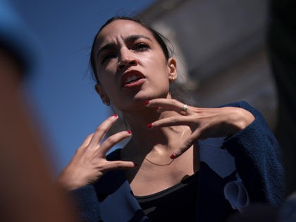 WASHINGTON, DC - JUNE 16: Rep. Alexandria Ocasio-Cortez (D-NY) speaks with supporters during an event outside Union Station June 16, 2021 in Washington, DC. Ocasio-Cortez, joined by Rep. Seth Moulton (D-NY) and Sen. Kirsten Gillibrand (D-NY), called for increased federal funding for high-speed rail in the infrastructure package being discussed …
