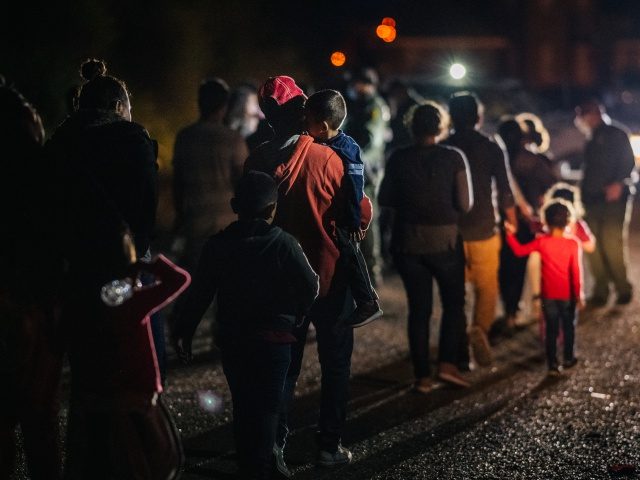 ROMA, TEXAS - JUNE 16: Immigrants seeking asylum walk to be processed and taken to a border patrol processing facility after crossing the Rio Grande into the U.S. on June 16, 2021 in Roma, Texas. A surge of mostly Central America immigrants crossing into the United States has challenged U.S. …