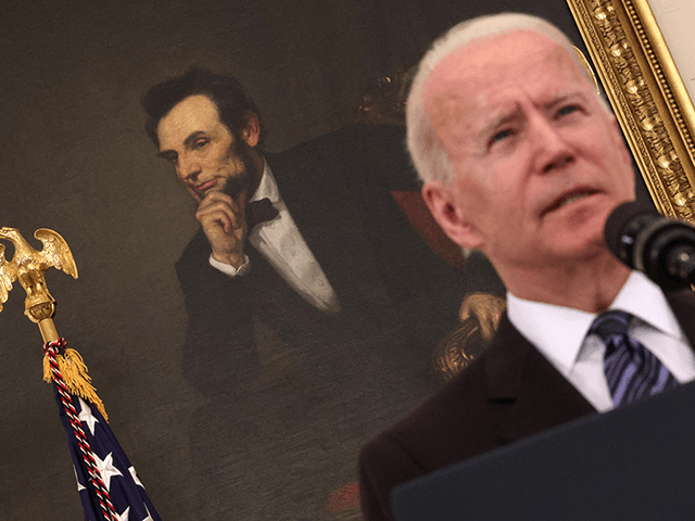 A portrait of President Abraham Lincoln is seen as President Joe Biden speaks on gun crime