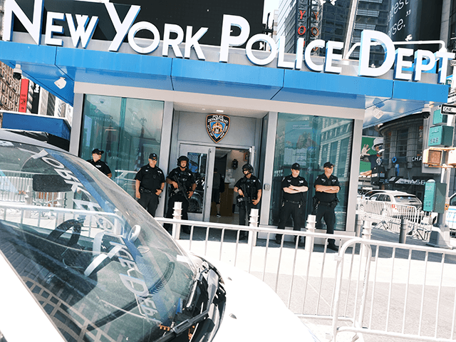 Police patrol in Times Square following another daytime shooting yesterday in the popular