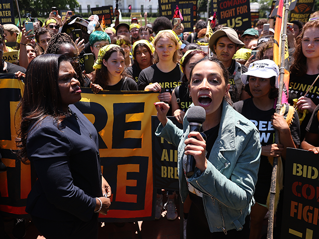 Rep. Cori Bush (D-MO) (L) and Rep. Alexandria Ocasio-Cortez (D-NY) rallying hundreds of young climate activists in Lafayette Square on the north side of the White House to demand that U.S. President Joe Biden work to make the Green New Deal into law on June 28, 2021 in Washington, DC. …