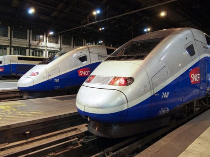 Paris, France - 29 August, 2011: Three french high speed trains TGV stop in Paris Gare de Lyon to pass midnight