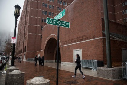 BOSTON, MA - JANUARY 04: A runner jogs past the John Joseph Moakley United States Courtho