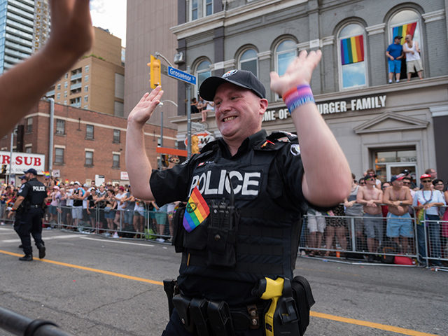 Toronto,ON, Canada - July 3, 2016: Police participation in Pride Parade. The 36th annual Pride Parade celebrates all kinds of diversity and life in Toronto while encouraging tolerance and acceptance.