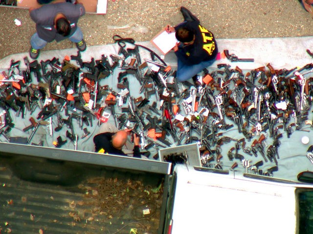 This photo from video provided by KCBS/KCAL-TV shows investigators from the U.S. Bureau of Alcohol, Tobacco, Firearms and Explosives and the police inspecting a large cache of weapons seized at a home in the affluent Holmby Hills area of Los Angeles Wednesday, May 8, 2019. Authorities seized more than a …