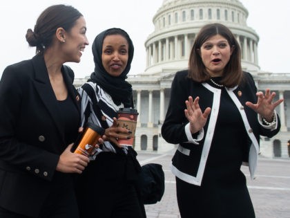 US Representative Alexandria Ocasio-Cortez, Democrat of New York; US Representative Ilhan Omar (C), Democrat of Minnesota; and US Representative Haley Stevens (R), Democrat of Michigan, arrive for a photo opportunity with the female House Democratic members of the 116th Congress outside the US Capitol in Washington, DC, January 4, 2019. …