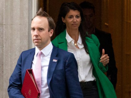 LONDON, ENGLAND - MAY 01: Health Secretary Matt Hancock followed by Gina Coladangelo, aide to the Health Secretary and Non-Executive Director at the Department of Health and Social Care, leave 10 Downing Street after the daily press briefing on May 01, 2020 in London, England. Mr Hancock announced that the …