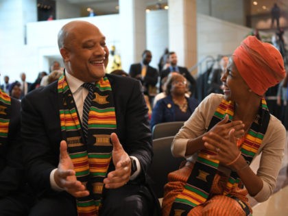 US Representative Ilhan Omar (R) and André Carson arrive for the Congressional Black Caucus (CBC) ceremony to commemorate the 400th anniversary of the first recorded forced arrival of enslaved Africans in the Emancipation Hall of the US Capitol in Washington, DC on September 10, 2019. (Photo by MANDEL NGAN / …