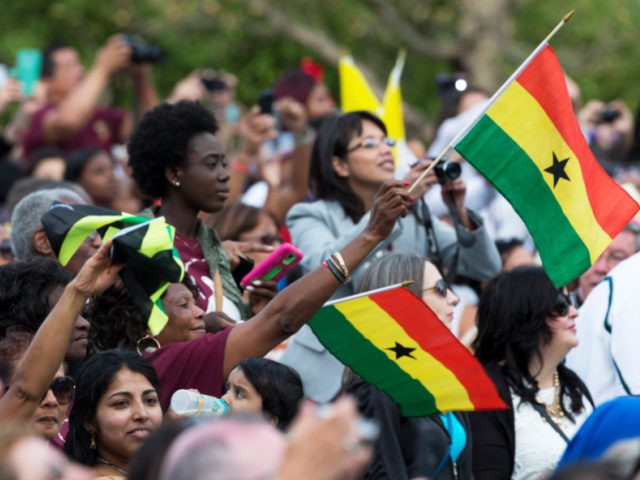 Worshippers wave the national flag of Ghana as Pope Francis arrives at Independence National Historical Park in Philadelphia, where he met members of the Hispanic community and other immigrants, Saturday, Sept. 26, 2015. (AP Photo/Alessandra Tarantino)
