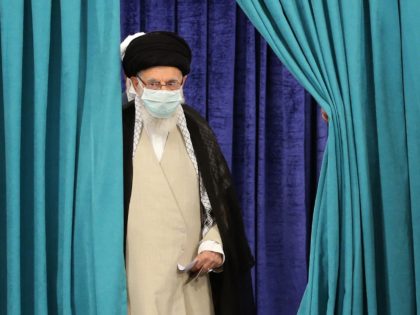 Iran's Supreme Leader Ayatollah Ali Khamenei wears a face mask due to the Covid-19 pandemic, as he arrives to cast his ballot, on June 18, 2021, on the day of the Islamic republic's presidential election. (Photo by Atta KENARE / AFP) (Photo by ATTA KENARE/AFP via Getty Images)
