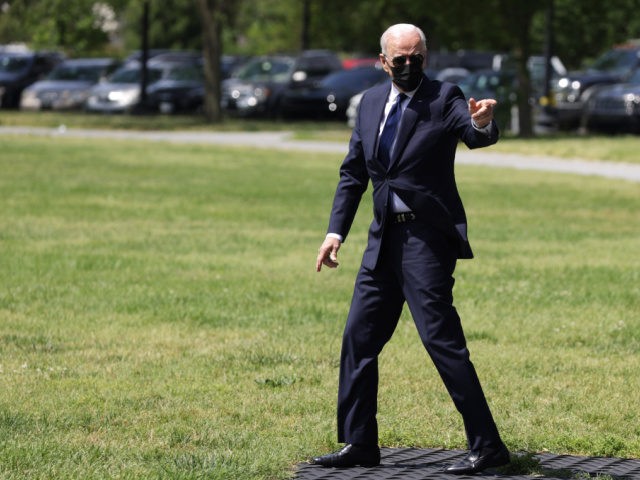 WASHINGTON, DC - JUNE 01: U.S. President Joe Biden gestures as he walks toward the Marine One for a departure from the Ellipse, south of the White House on June 1, 2021 in Washington, DC. President Biden is traveling to Tulsa, Oklahoma to mark the 100th anniversary of the Tulsa …