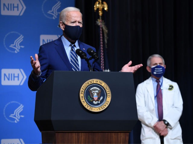 US President Joe Biden speaks, flanked by White House Chief Medical Adviser on Covid-19 Dr. Anthony Fauci (R) during a visit to the National Institutes of Health (NIH) in Bethesda, Maryland, February 11, 2021. (Photo by SAUL LOEB / AFP) (Photo by SAUL LOEB/AFP via Getty Images)