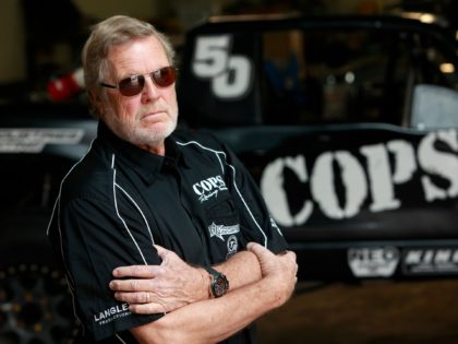 EL SEGUNDO, CA - NOVEMBER 01: SCORE International CEO Saul Fish (not pictured) gives Cops Racing Team owner (and former Baja 1000 winner) John Langley a preview of the watch at Cops Racing on November 1, 2012 in El Segundo, California. GRAHAM WATCHES, one of the world's finest watch companies, …