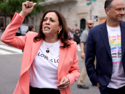 WASHINGTON, DC - JUNE 12: U.S. Vice President Kamala Harris speaks to marchers, as her husband Doug Emhoff looks on, during the Capitol Pride Parade on June 12, 2021 in Washington, DC. Capital Pride returned to Washington DC, after being canceled last year due to the Covid-19 pandemic. (Photo by …