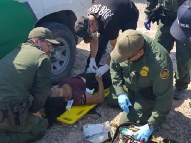 Laredo South Station Border Patrol agents and Rio Bravo Fired Department EMS workers tend