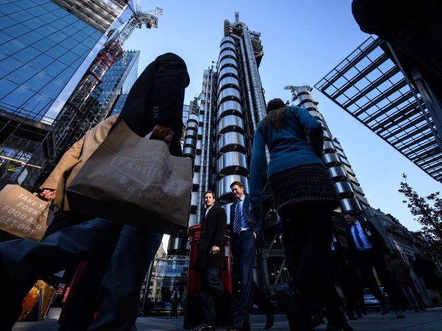 LONDON, ENGLAND - JANUARY 20: City workers walk past the Lloyds building in the financial