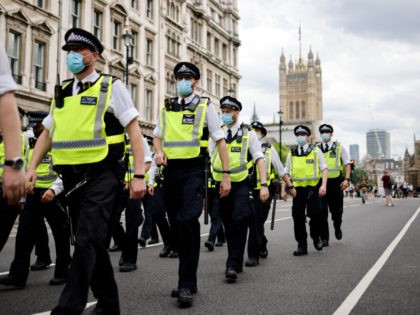 Police officers patrol the streets of Westminster as protesters gather for a demonstration against government lockdown restrictions in central London on June 14, 2021. - Britain was on Monday widely expected to delay the full lifting of coronavirus restrictions due to a surge of infections caused by the Delta variant. …