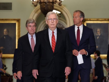 WASHINGTON, DC - JUNE 15: Senate Minority Leader Mitch McConnell (R-KY) (C) walks with U.S. Sen. Roy Blunt (L) (R-MO) and U.S. Sen. John Thune (R-SD) as they leave a Republican Senate luncheon at the U.S. Capitol Building on June 15, 2021 in Washington, DC. The Senate is in negotiations …