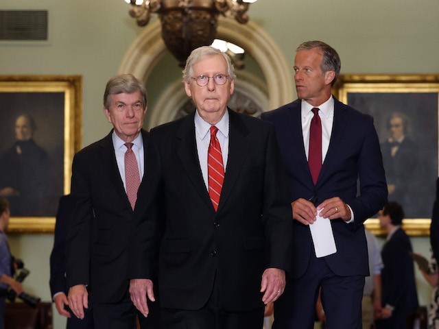 WASHINGTON, DC - JUNE 15: Senate Minority Leader Mitch McConnell (R-KY) (C) walks with U.S. Sen. Roy Blunt (L) (R-MO) and U.S. Sen. John Thune (R-SD) as they leave a Republican Senate luncheon at the U.S. Capitol Building on June 15, 2021 in Washington, DC. The Senate is in negotiations for a bipartisan infrastructure deal. (Photo by Kevin Dietsch/Getty Images)