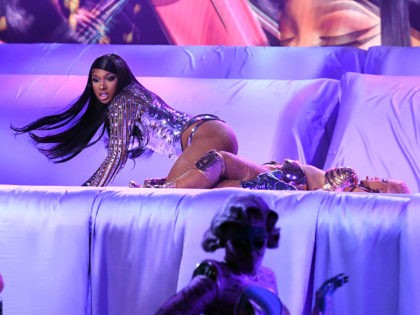 LOS ANGELES, CALIFORNIA: In this image released on March 14, (L-R) Megan Thee Stallion and Cardi B perform onstage during the 63rd Annual GRAMMY Awards at Los Angeles Convention Center in Los Angeles, California and broadcast on March 14, 2021. (Photo by Kevin Winter/Getty Images for The Recording Academy)