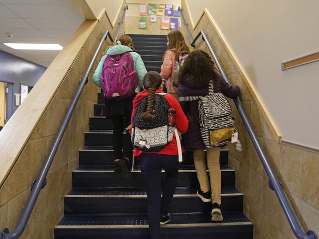 Students arrive for school at Freedom Preparatory Academy on February 10, 2021 in Provo, Utah. Freedom Academy has done in person instruction since the middle of August of 2020 with only four days of school canceled due to COVID-19 outbreak. (Photo by George Frey/Getty Images)