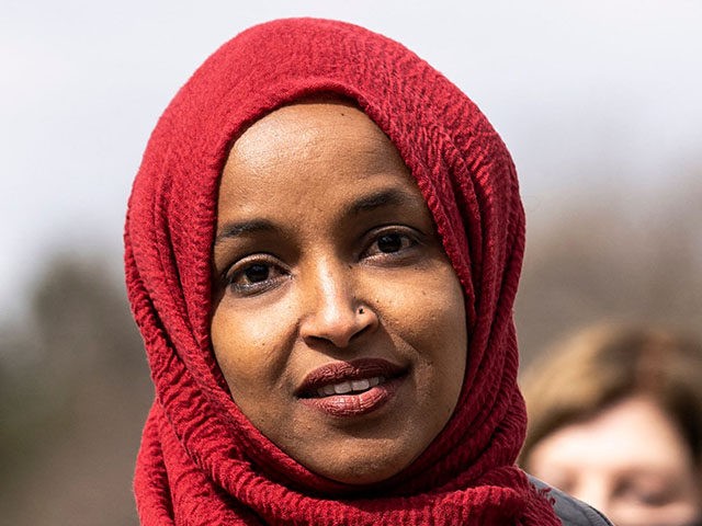 Rep. Ilhan Omar (C) (D-MN) speaks during a press conference at a memorial site for Daunte Wright in Brooklyn Center, Minnesota on April 20, 2021. - Jurors began a first full day of deliberations on Tuesday in the trial of the former Minneapolis police officer charged with murdering George Floyd …
