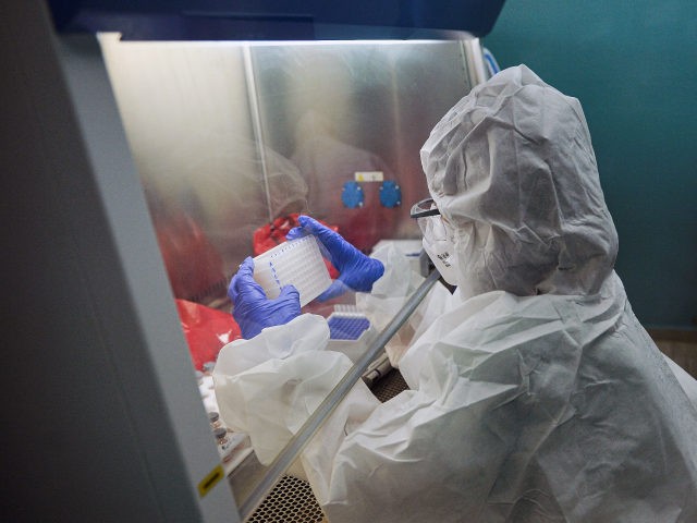 A technician of the Molecular Biology Laboratory of Villa Clara, in Cuba, analyzes PCR samples amid the novel coronavirus, COVID-19, pandemic, on April 25, 2021. (Photo by Yamil LAGE / AFP) (Photo by YAMIL LAGE/AFP via Getty Images)