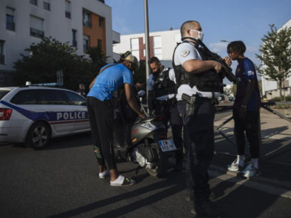 Police officers stop and search a motorbike rider and his passenger who did not wear any helmets, in the Paris suburb of Villiers-le-Bel, Tuesday, June, 15, 2021. In the run-up to France's presidential elections in 2022, crime and policing are again becoming hot-button issues. Some political opponents of President Emmanuel …