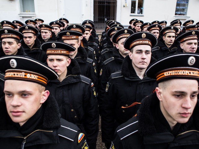 SEVASTOPOL, CRIMEA - MARCH 18: Navy sailors prepare to march as people celebrate the first anniversary of the signing of the decree on the annexation of the Crimea by the Russian Federation, on March 18, 2015 in Sevastopol, Crimea. Crimea, an internationally recognised Ukrainian territory with special status, was annexed …