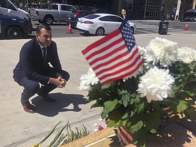 San Jose Mayor Sam Liccardo stops to view a makeshift memorial for the railyard shooting victims in front of City Hall in San Jose, Calif., on Thursday, May 27, 2021. An employee opened fire Wednesday at a California rail yard, killing eight people before taking his own life as law …