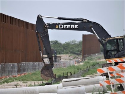 Construction crews work on dismantling Trump's Border Wall near Del Rio, Texas in June 2021. (Photo: Bob Price/Breitbart Texas)