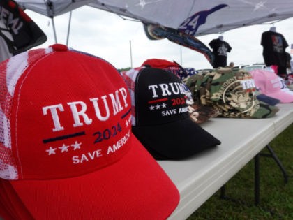 WELLINGTON, OHIO - JUNE 26: Vendors sell political merchandise at a rally with former President Donald Trump at the Lorain County Fairgrounds on June 26, 2021 in Wellington, Ohio. Trump is in Ohio to campaign for his former White House advisor Max Miller. Miller is challenging incumbent Rep. Anthony Gonzales …