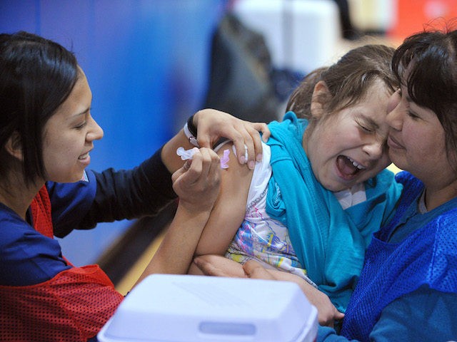 A student at Carlin Springs Elementary School receives an H1N1 flu vaccination January 7,