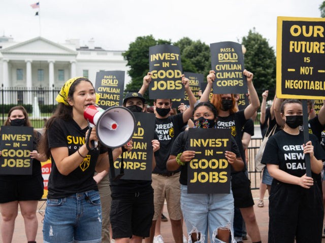 Protesters with the Sunrise Movement protest in front of the White House against what they say is slow action on infrastructure legislation, job creation and addressing climate change, as well as against attempts to work with Senate Republicans in Washington, DC, June 4, 2021. (Photo by SAUL LOEB / AFP) …