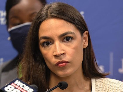 NEW YORK, NEW YORK - JUNE 03: Rep. Alexandria Ocasio-Cortez (D-NY) listens as she is asked a question during a press conference at Jacobi Hospital in the Morris Park neighborhood on June 03, 2021 in the Bronx borough of New York City. Senate Majority Leader Chuck Schumer (D-NY), joined by …