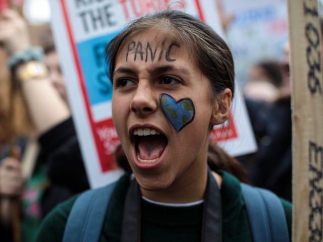 LONDON, ENGLAND - MARCH 15: A girl wears face paint as schoolchildren take part in a student climate protest on March 15, 2019 in London, England. Thousands of pupils from schools, colleges and universities across the UK will walk out today in the second major strike against climate change this year. Young people nationwide are calling on the Government to declare a climate emergency and take action. Similar strikes are taking place around the world today including in Japan and Australia, inspired by 16-year-old Greta Thunberg who criticised world leaders at a United Nations climate conference. (Photo by Jack Taylor/Getty Images)