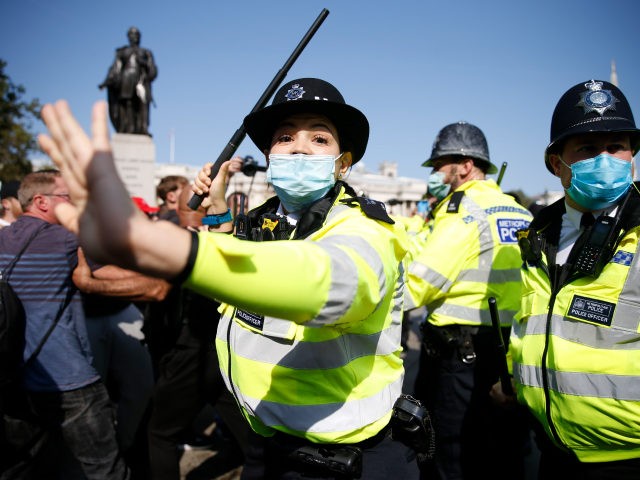 LONDON, ENGLAND - SEPTEMBER 19: Protestors clash with Met Police officers during an Anti-V