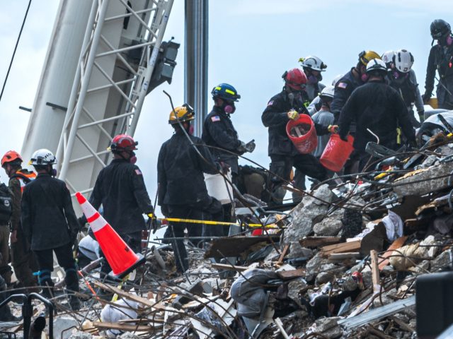 Search and Rescue teams look for possible survivors and to recover remains in the partially collapsed 12-story Champlain Towers South condo building on June 29, 2021 in Surfside, Florida. - The death toll after the collapse of a Florida apartment tower has risen to nine, the local mayor said on …