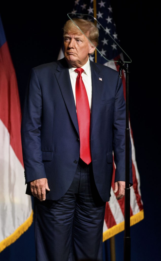 Former U.S. President Donald Trump listens to Ted Budd announce he's running for the NC Senate at the NCGOP state convention on June 5, 2021 in Greenville, North Carolina. The event is one of former U.S. President Donald Trumps first high-profile public appearances since leaving the White House in January. (Photo by Melissa Sue Gerrits/Getty Images)
