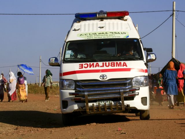 An ambulance drives in a border reception centre (Village 8), housing Ethiopian refugees w