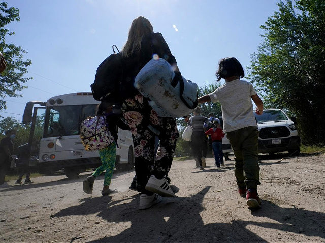 A migrant family from Venezuela move to Border Patrol transport vehicle after they and other migrants crossed the U.S.-Mexico border and turned themselves in Wednesday, June 16, 2021, in Del Rio, Texas. Last month, more than 7,000 Venezuelans were encountered along the U.S.-Mexico border, more than all previous 14 years …