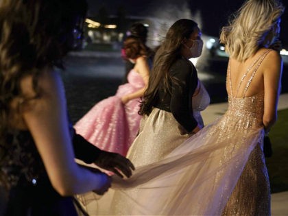 Young people attend prom at the Grace Gardens Event Center in El Paso, Texas on Friday, Ma